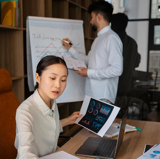 office-workers-using-finance-graphs 1